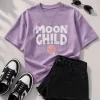 Lavender Moon Child graphic print t-shirt styled with black denim shorts and black and white sneakers, aesthetic flat lay outfit