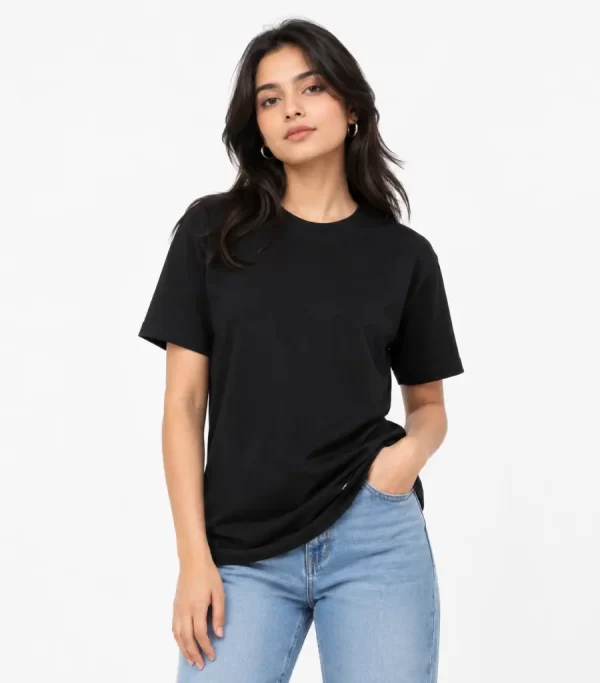 Woman wearing classic black cotton t-shirt with blue denim jeans, casual everyday outfit