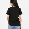 Woman wearing classic black cotton t-shirt with blue denim jeans, casual everyday outfit