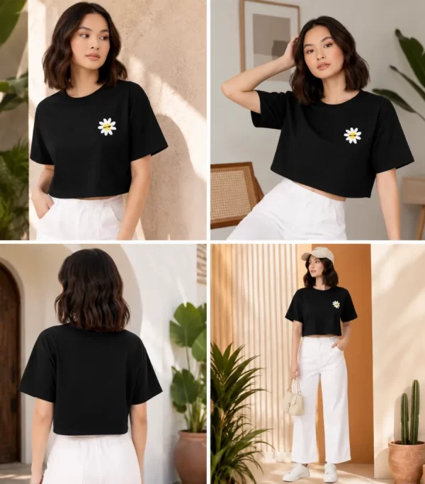 Woman wearing black cropped t-shirt with cute daisy sunglasses graphic design, paired with white pants