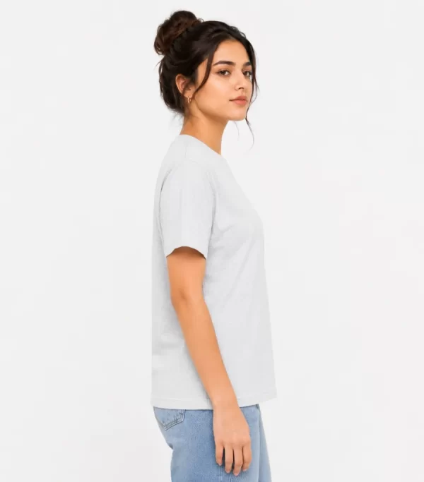 Woman wearing heather grey cotton t-shirt with blue denim jeans, casual everyday outfit