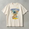Woman wearing cream oversized t-shirt with Creative Smile teddy bear streetwear graphic print