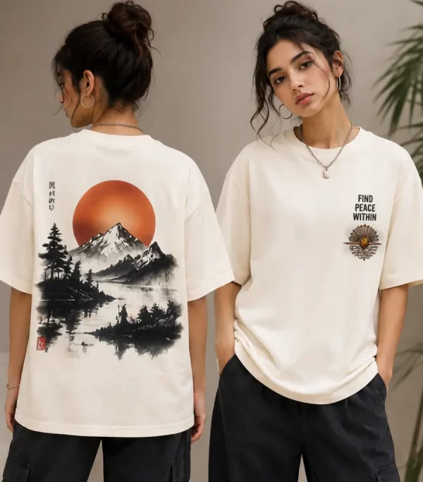 Woman wearing beige oversized t-shirt with Japanese ink-style mountain and red sun print on back, 'Find Peace Within' text with medallion graphic on front