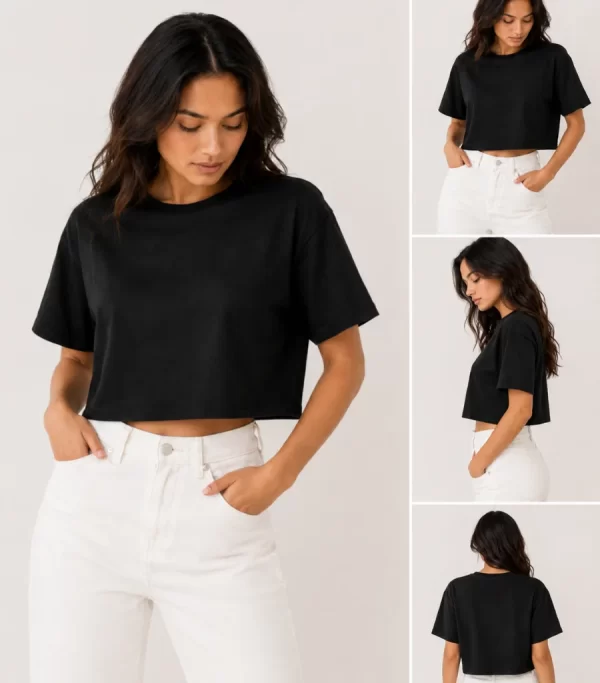 Woman wearing black oversized cropped t-shirt with boxy fit, paired with white jeans