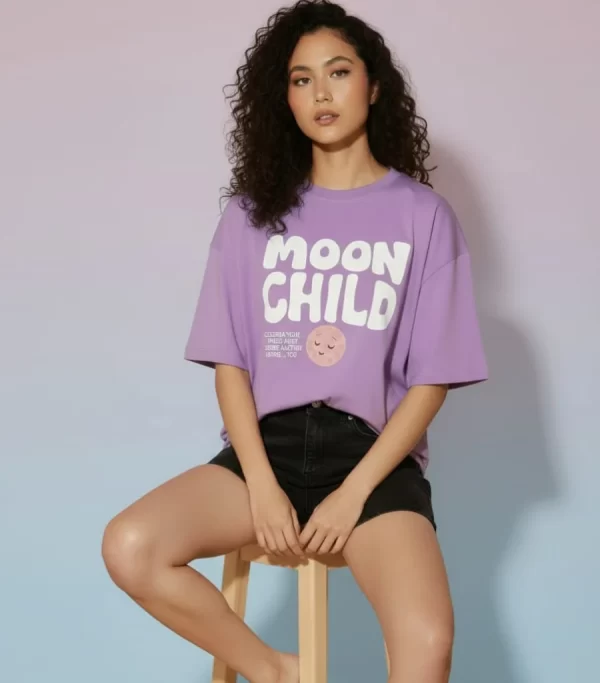 Lavender Moon Child graphic print t-shirt styled with black denim shorts and black and white sneakers, aesthetic flat lay outfit