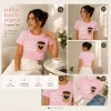 Woman wearing pink Coffee Teach Repeat graphic t-shirt with coffee cup design, ideal teacher gift tee