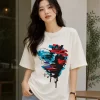 Image 1 (Front View) Women's oversized white graphic printed cotton t-shirt front view with abstract colorful face print. Image 2 (Side View) Women's white oversized graphic t-shirt side profile featuring modern abstract print and relaxed fit. Image 3 (Back View) Women's oversized white cotton t-shirt back view showing plain design with half sleeves and relaxed fit. Image 4 (Angled View) Women's oversized white graphic print t-shirt angled view with premium cotton fabric and casual streetwear style.