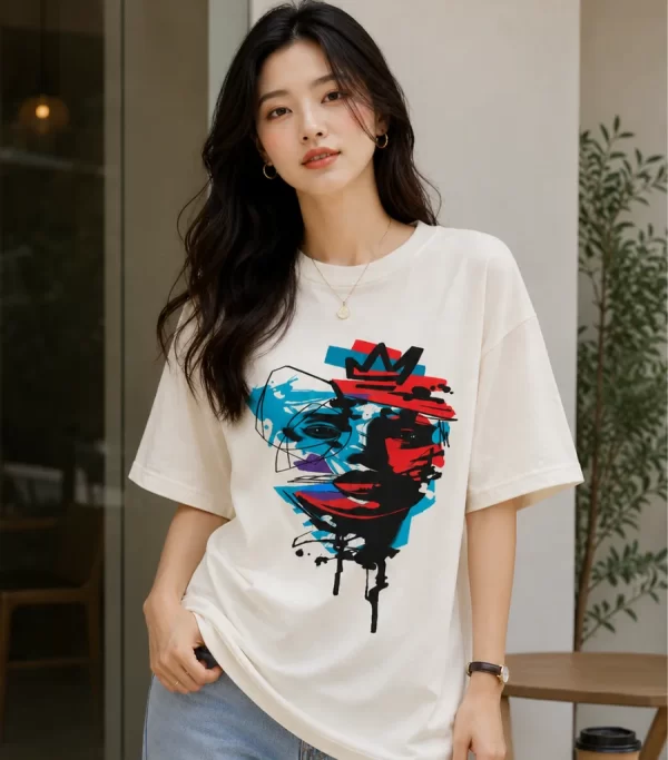 Image 1 (Front View) Women's oversized white graphic printed cotton t-shirt front view with abstract colorful face print. Image 2 (Side View) Women's white oversized graphic t-shirt side profile featuring modern abstract print and relaxed fit. Image 3 (Back View) Women's oversized white cotton t-shirt back view showing plain design with half sleeves and relaxed fit. Image 4 (Angled View) Women's oversized white graphic print t-shirt angled view with premium cotton fabric and casual streetwear style.