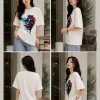 Image 1 (Front View) Women's oversized white graphic printed cotton t-shirt front view with abstract colorful face print. Image 2 (Side View) Women's white oversized graphic t-shirt side profile featuring modern abstract print and relaxed fit. Image 3 (Back View) Women's oversized white cotton t-shirt back view showing plain design with half sleeves and relaxed fit. Image 4 (Angled View) Women's oversized white graphic print t-shirt angled view with premium cotton fabric and casual streetwear style.