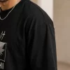 man wearing black oversized Kakashi anime t-shirt