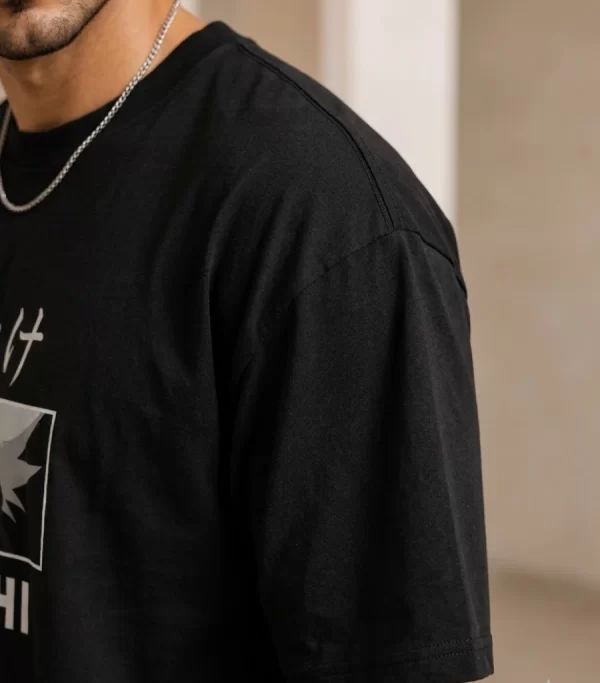 man wearing black oversized Kakashi anime t-shirt